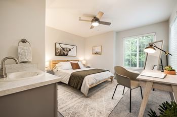 Bedroom with desk area and ceiling fan
